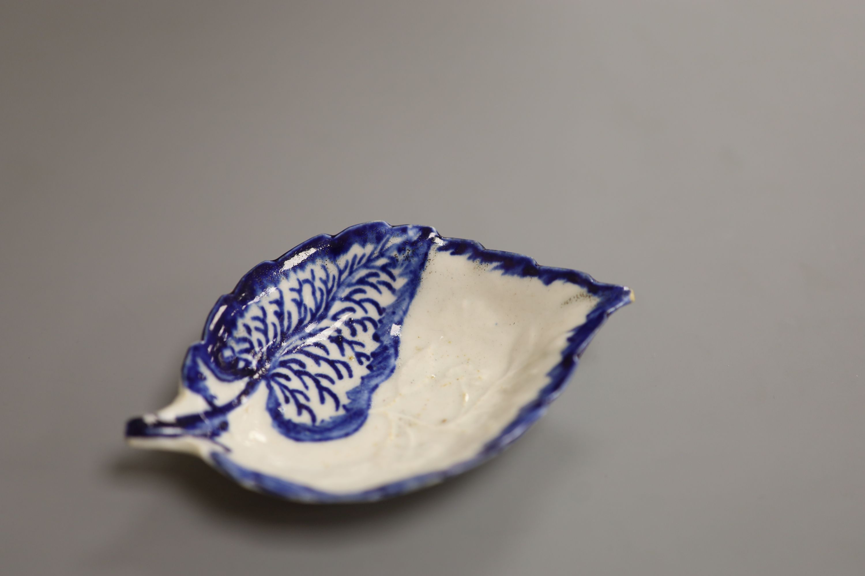 A Liverpool shape pickle dish, with leaves and flowers, c.1765, length 11.5cm